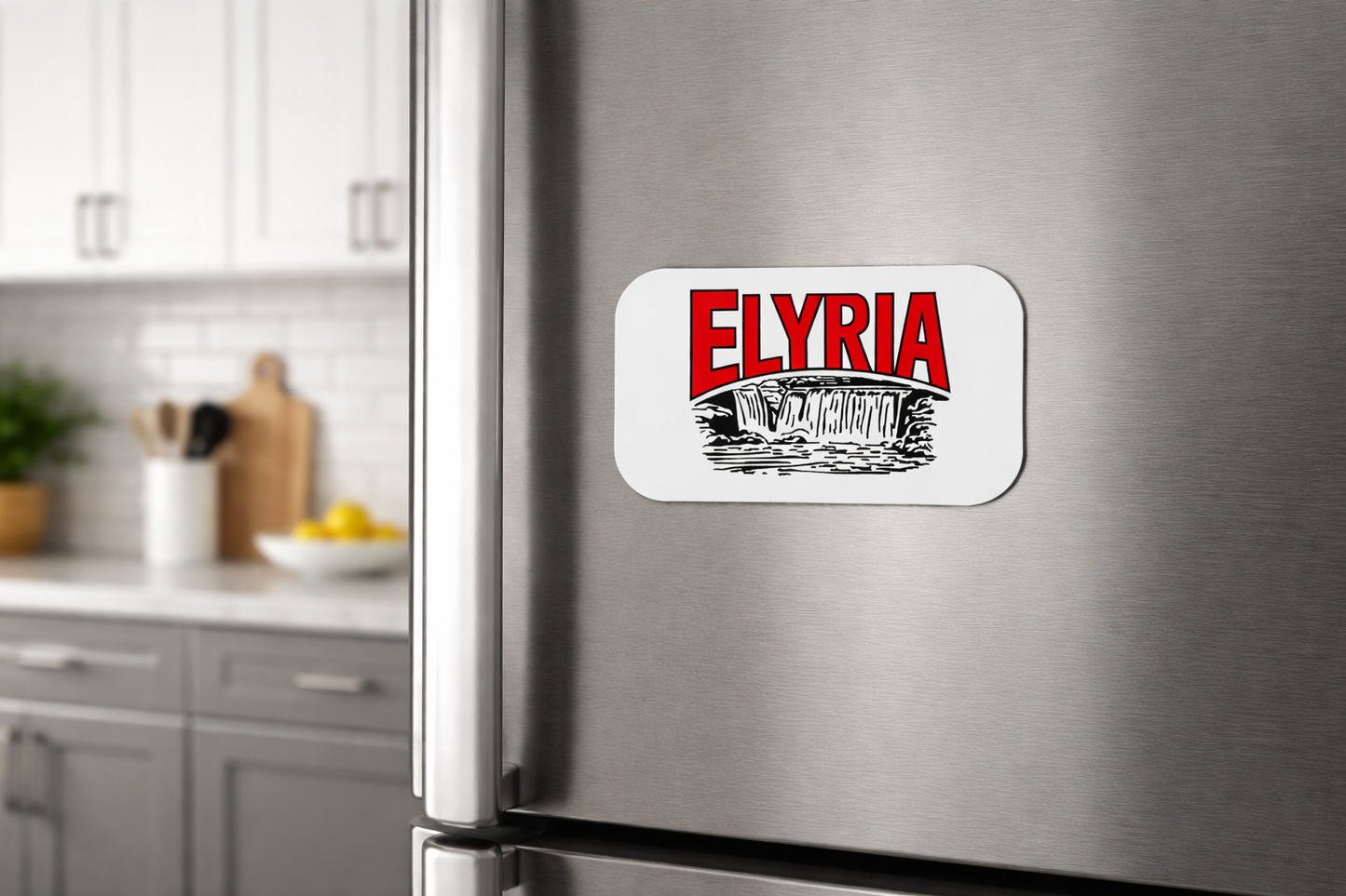 Fridge magnet with 'Elyria' text on a stainless steel refrigerator