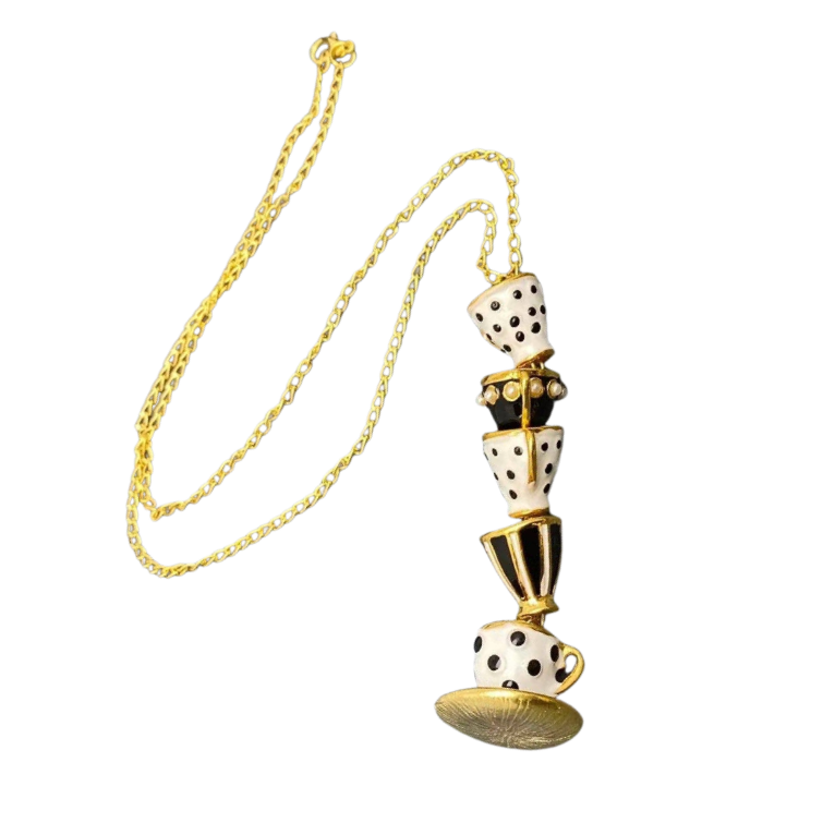 Necklace with a unique design featuring tea cups with gold accents on a gold chain