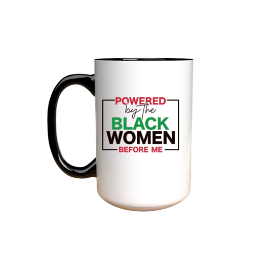 White mug with black handle featuring text 'Powered by the Black Women Before Me' 