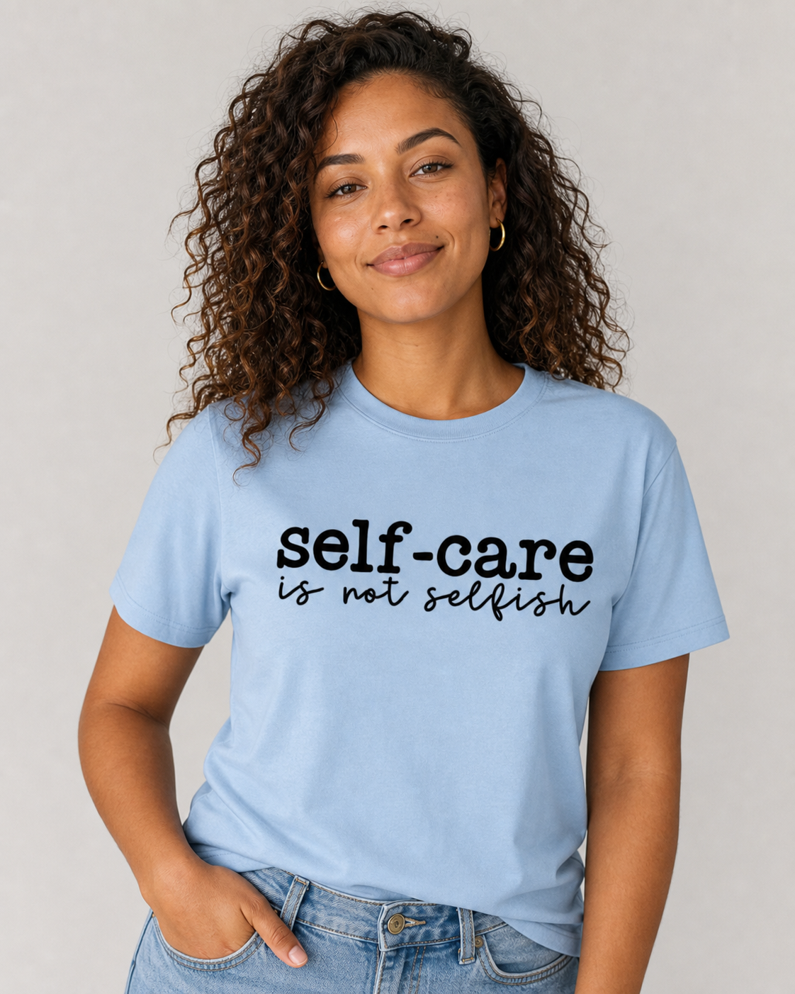  light blue t-shirt with 'self-care is not selfish' text in black